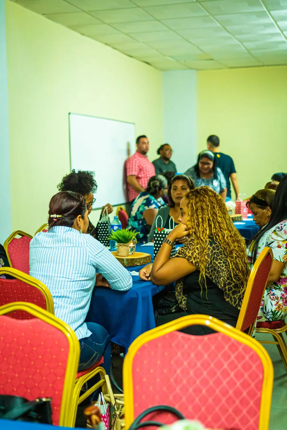 Adults seated around a table in a digital skills session
