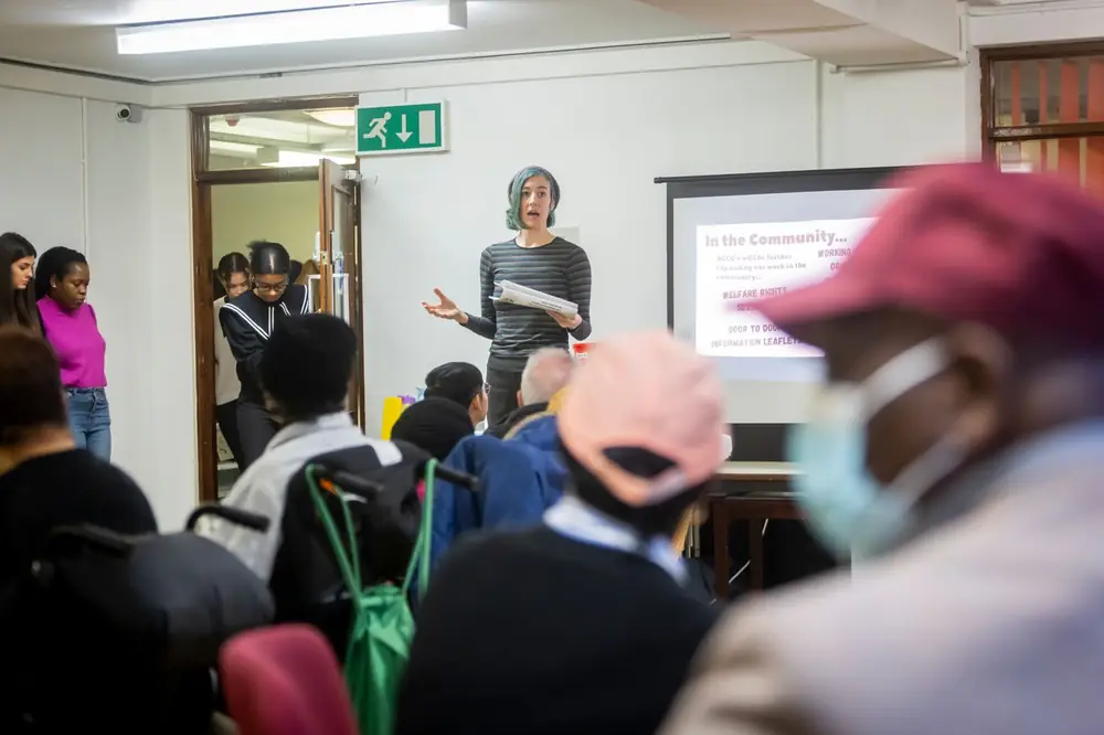 A presenter running a community learning session