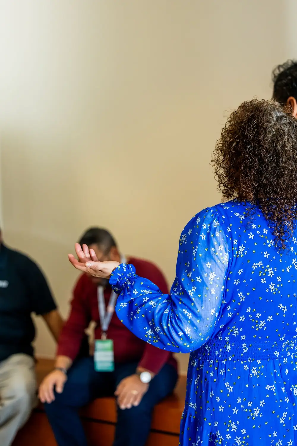 A facilitator leading a group discussion indoors