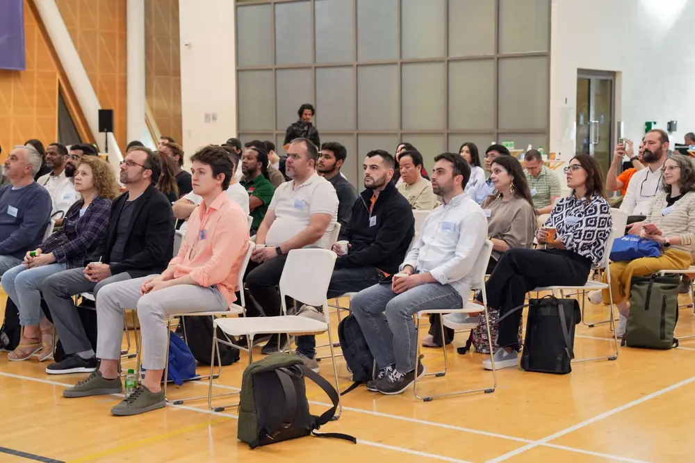 A large audience listening at a professional conference
