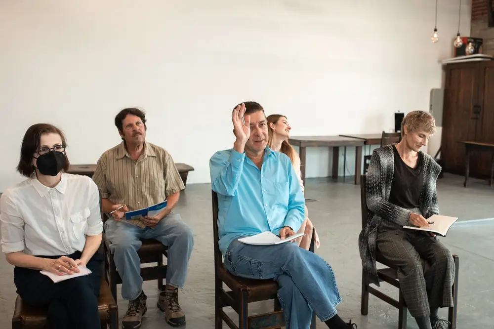 Adults taking notes during a professional training workshop